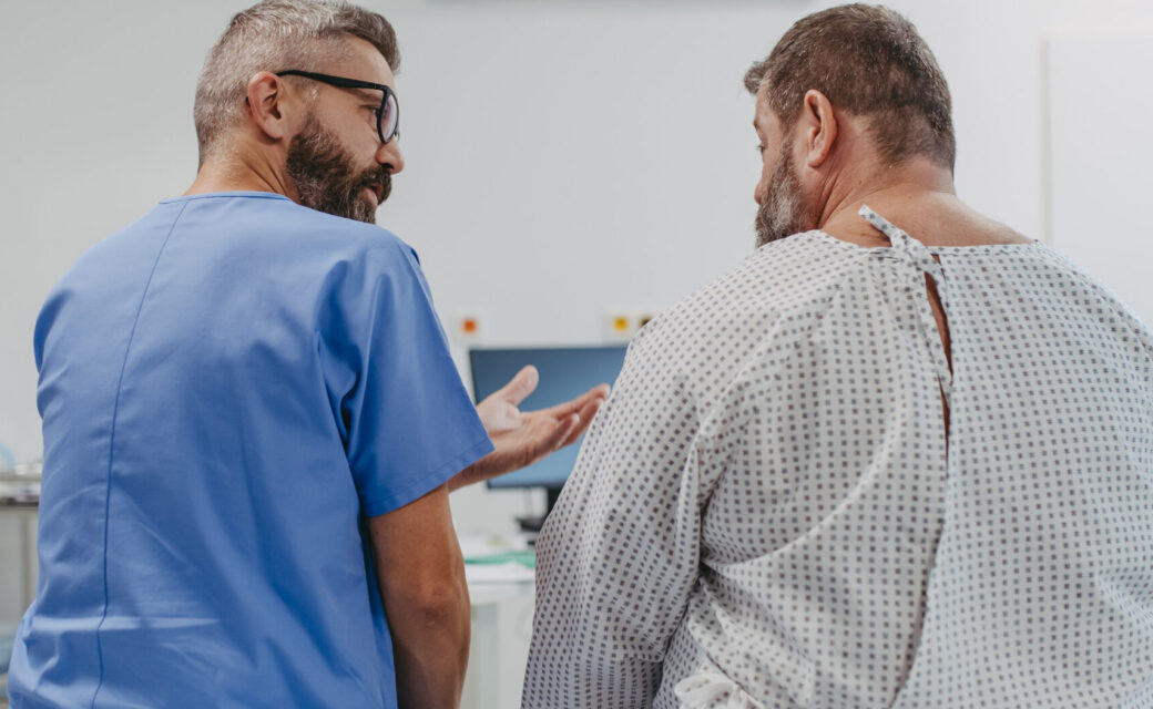 Supportive doctor soothing a worried overweight patient, discussing test result in emergency room. Illnesses and diseases in middle-aged men's health. Compassionate physician supporting stressed patient. Concept of health risks of overwight and obesity.